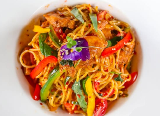 Colorful gourmet pasta dish with vegetables