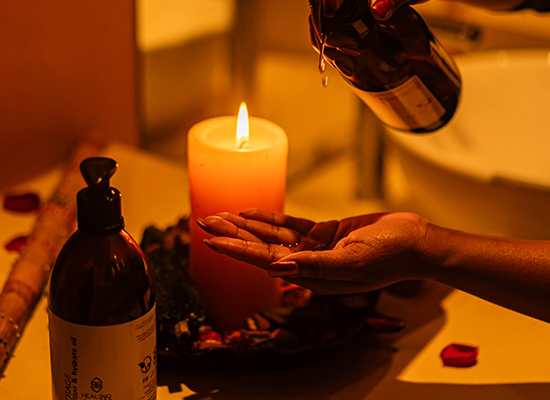 Spa setup with candle and oil bottle